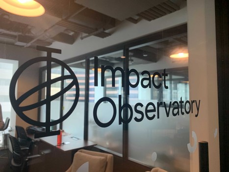 IO logo on glass office door